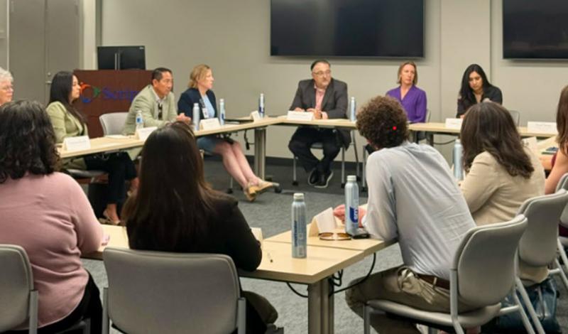 Senator Blakespear at conference table with health care officials.