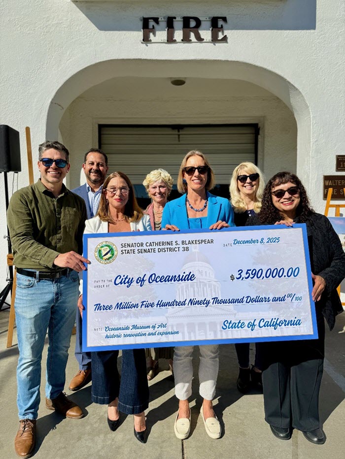 I recently presented a check to the City of Oceanside for Oceanside Museum of Art’s planned historic renovation and expansion project. Pictured (left to right) are Oceanside Deputy Mayor Eric Joyce; Oceanside City Manager Jonathan Borrego; OMA Executive Director Maria Mingalone; Allyson Handley‚ President of the OMA Board of Directors; myself; Kristi Hawthorne‚ Director of the Oceanside Historical Society; and Oceanside Mayor Esther C. Sanchez.