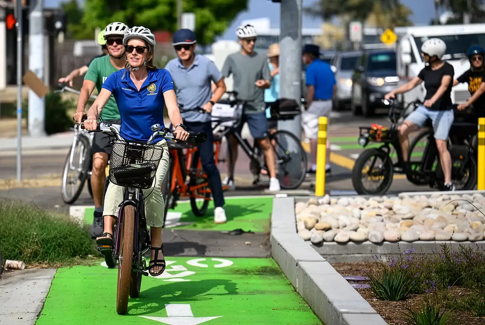 Senator Blakespear rides along the barrier protected bike lane on Santa Fe Drive