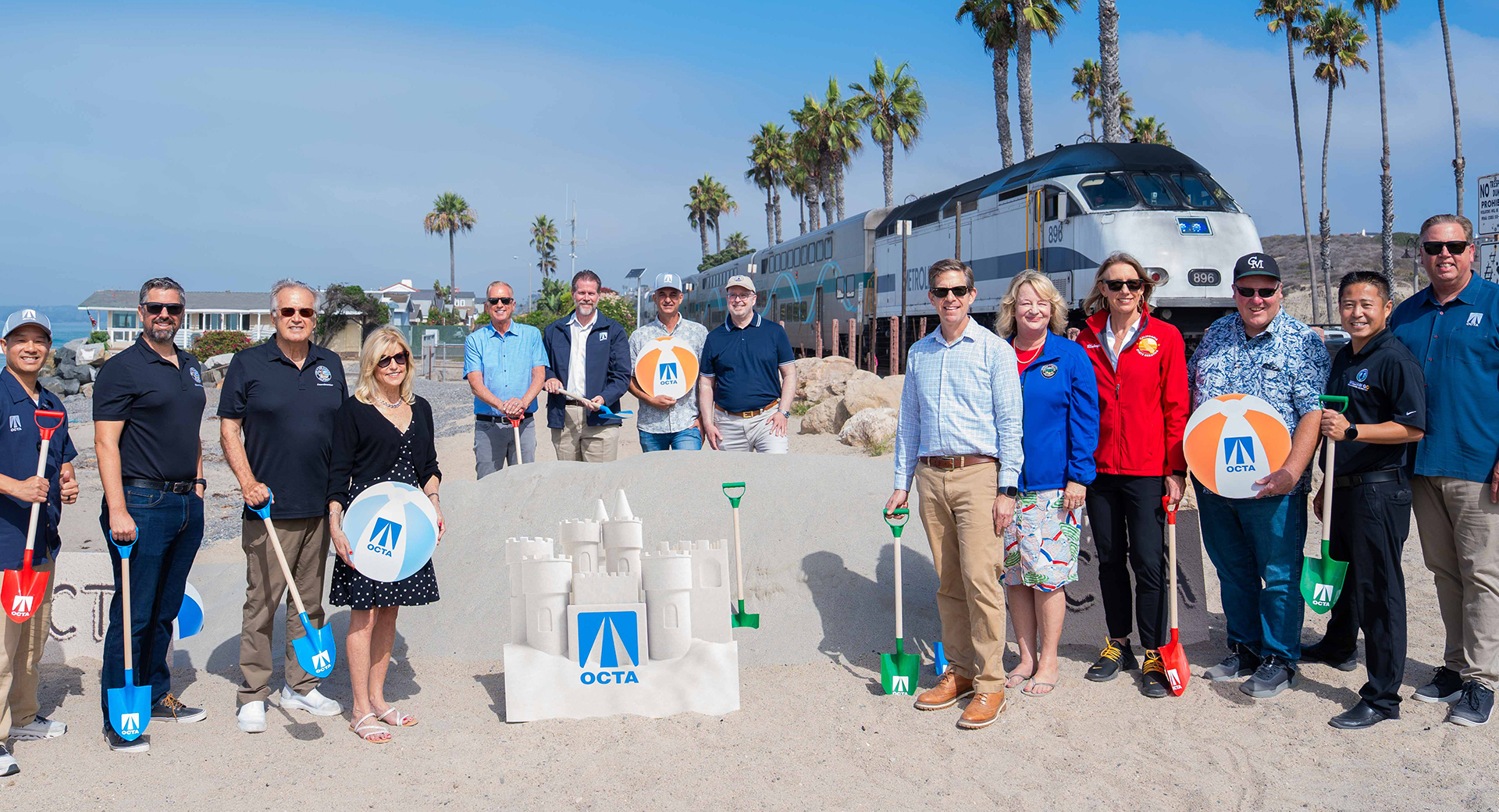 Senator Blakespear gathered near a train station